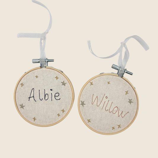 Small embroidery hoop with stitched name